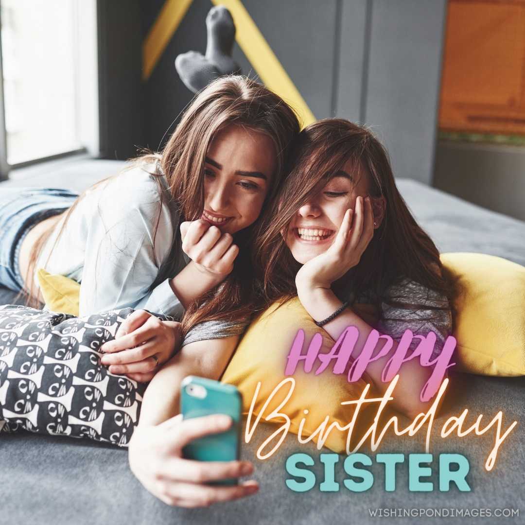 two cute smiling twins sisters holding smartphone. Happy Birthday Sister Images